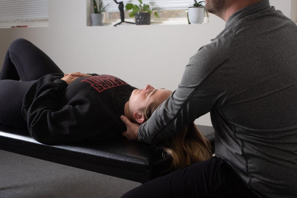 Jaw Pain and TMJ Complaints? Discover how Osteopathy Can Help 1 Photo of Dmitro Jovnyruk treating the patient's neck and jaw pain at JD Osteopathy Mississauga