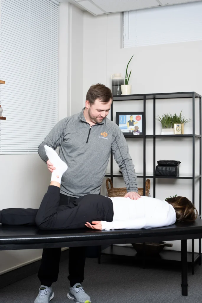 Photo of Dmitro Jovnyruk treating the sacrum, pelvic tilt, and lower back in prone position
